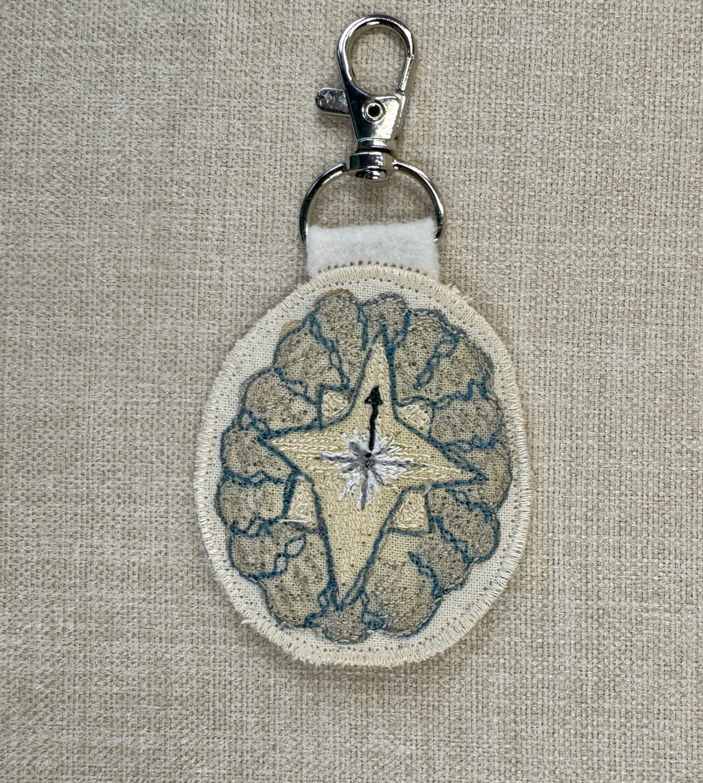Selkie “Searching - Compass Shell” Talisman – Free Motion Embroidered Patch / Bag Charm - Bag Charm image