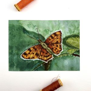 A Comma Butterfly embroidery print by Wild Minder, a symbol of Resilience.