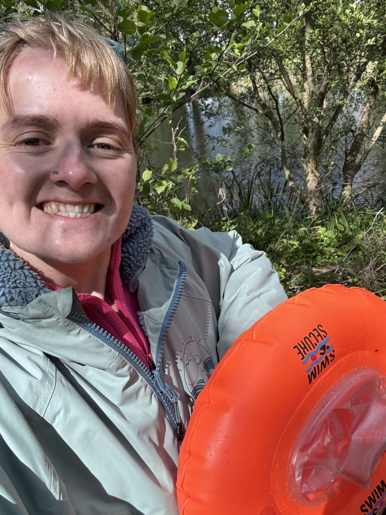A picture of me dressed in my dry robe and with my orange tow float.
