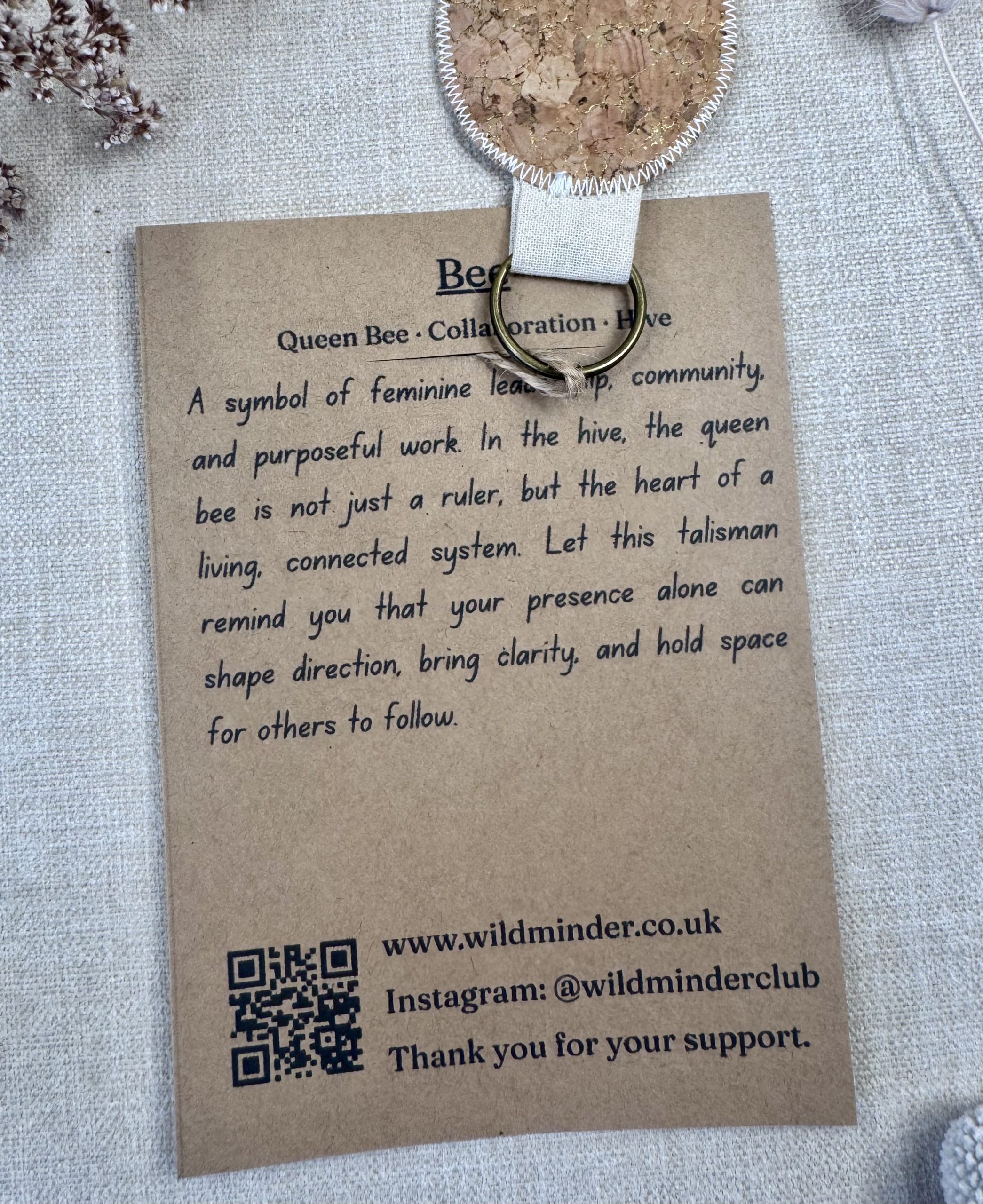 A photo of the Bee Talisman backing card